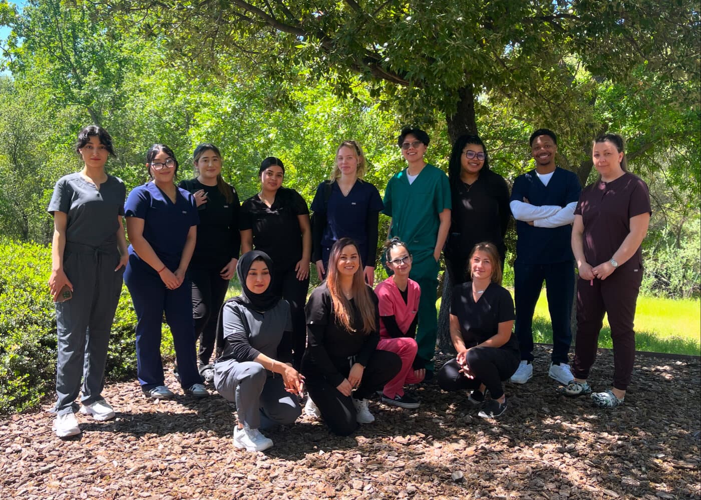 Roseville Dental Academy students gathered for a class photo in scrubs.
