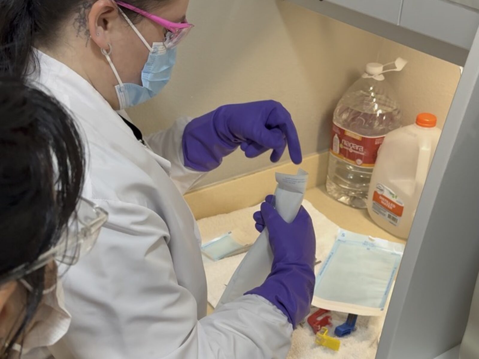 Students learning infection control and sterilization workflow