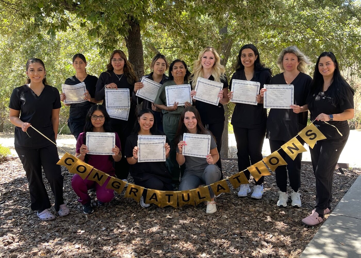 Students celebrating course completion certificates