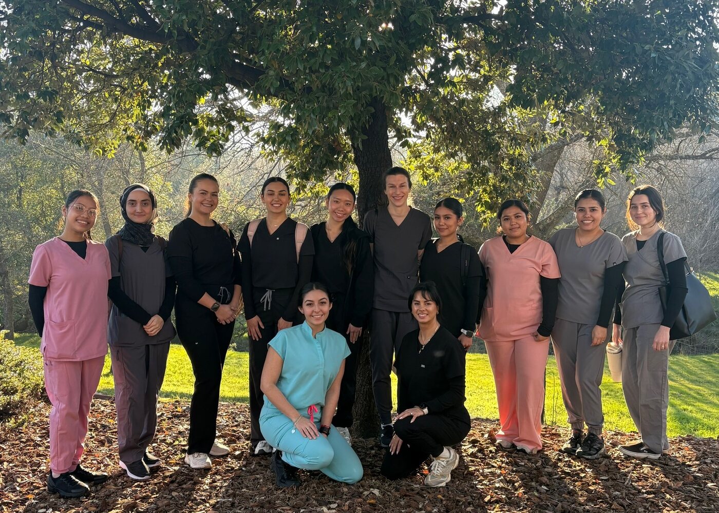 Recent class group photo outside the academy