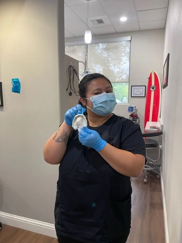 Students learning dental office workflow